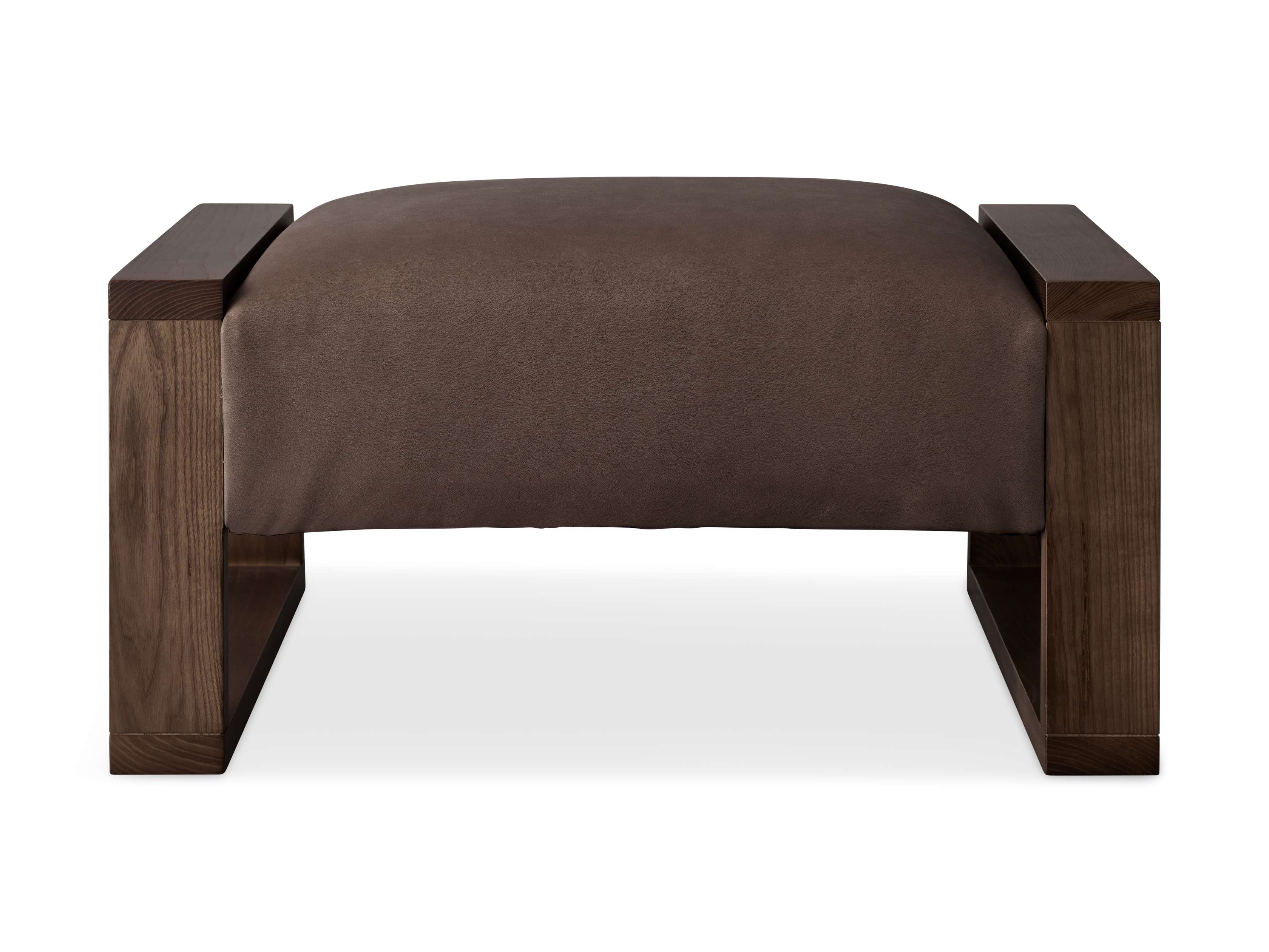Brown leather upholstered ottoman with a rectangular wooden frame, showcasing a rustic and modern design.