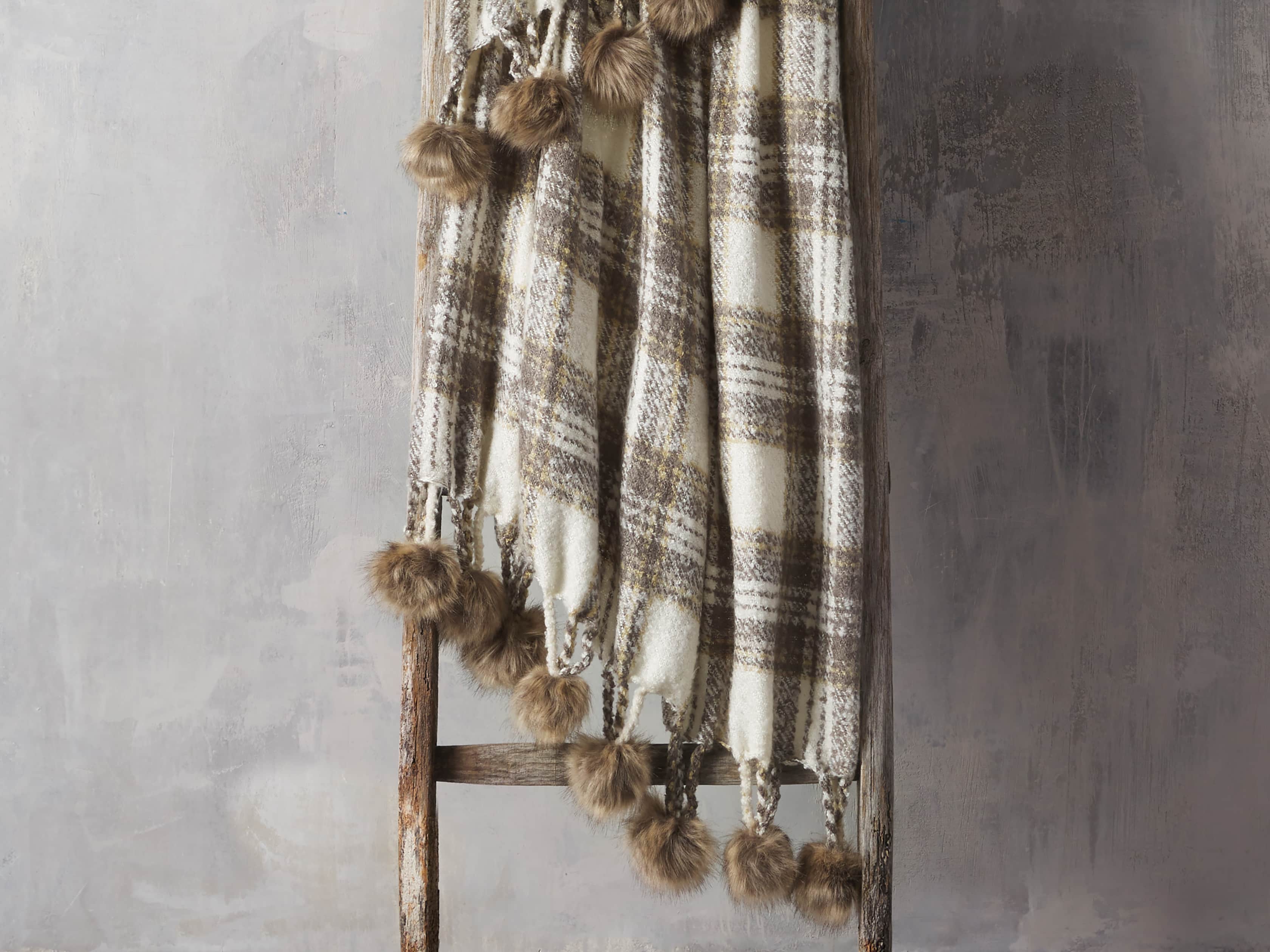 Charcoal Tartan Throw with Faux Fur Pom Poms, slide 1 of 3