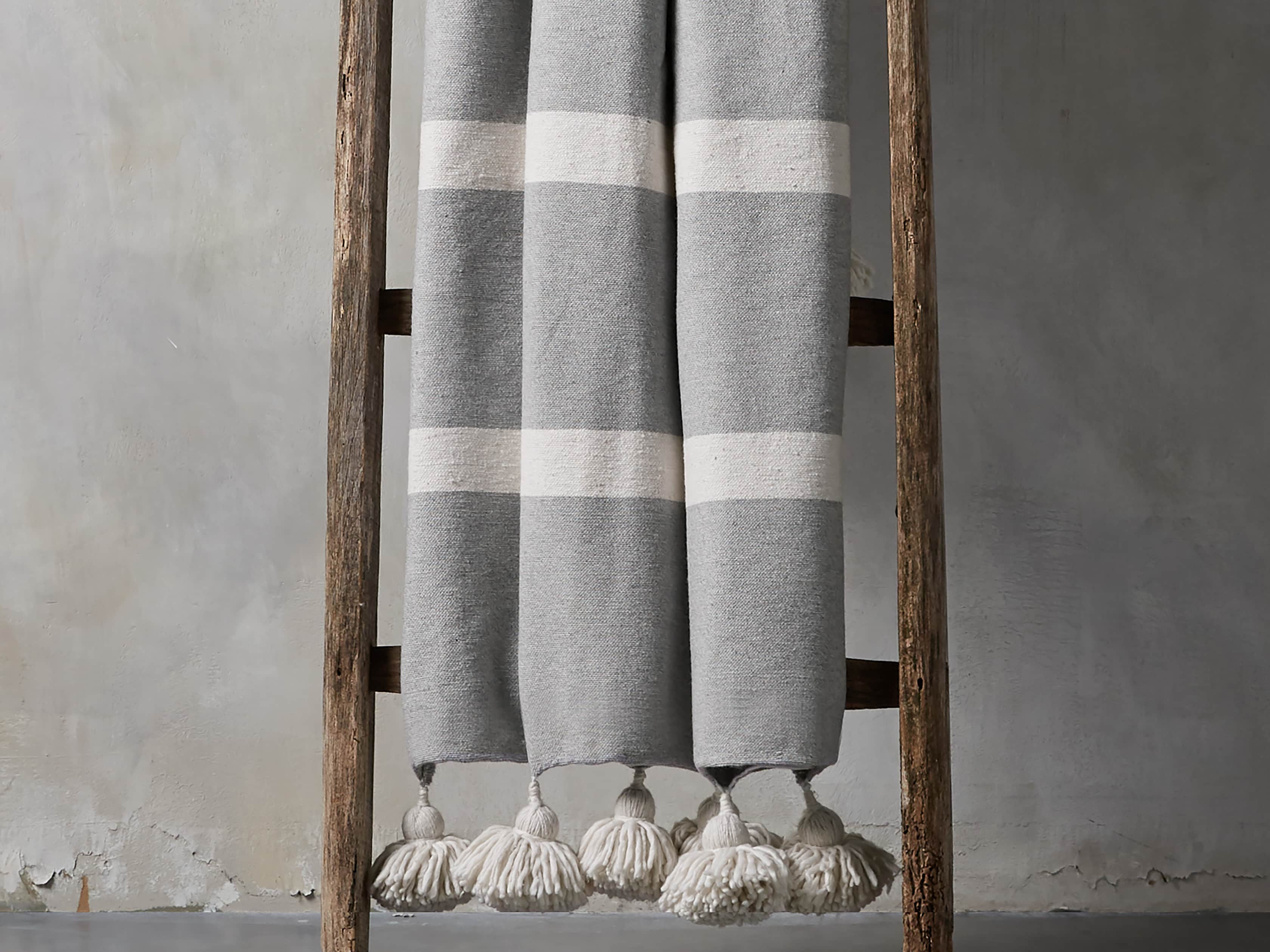 Moroccan Pom Pom Blanket in Grey Stripe
