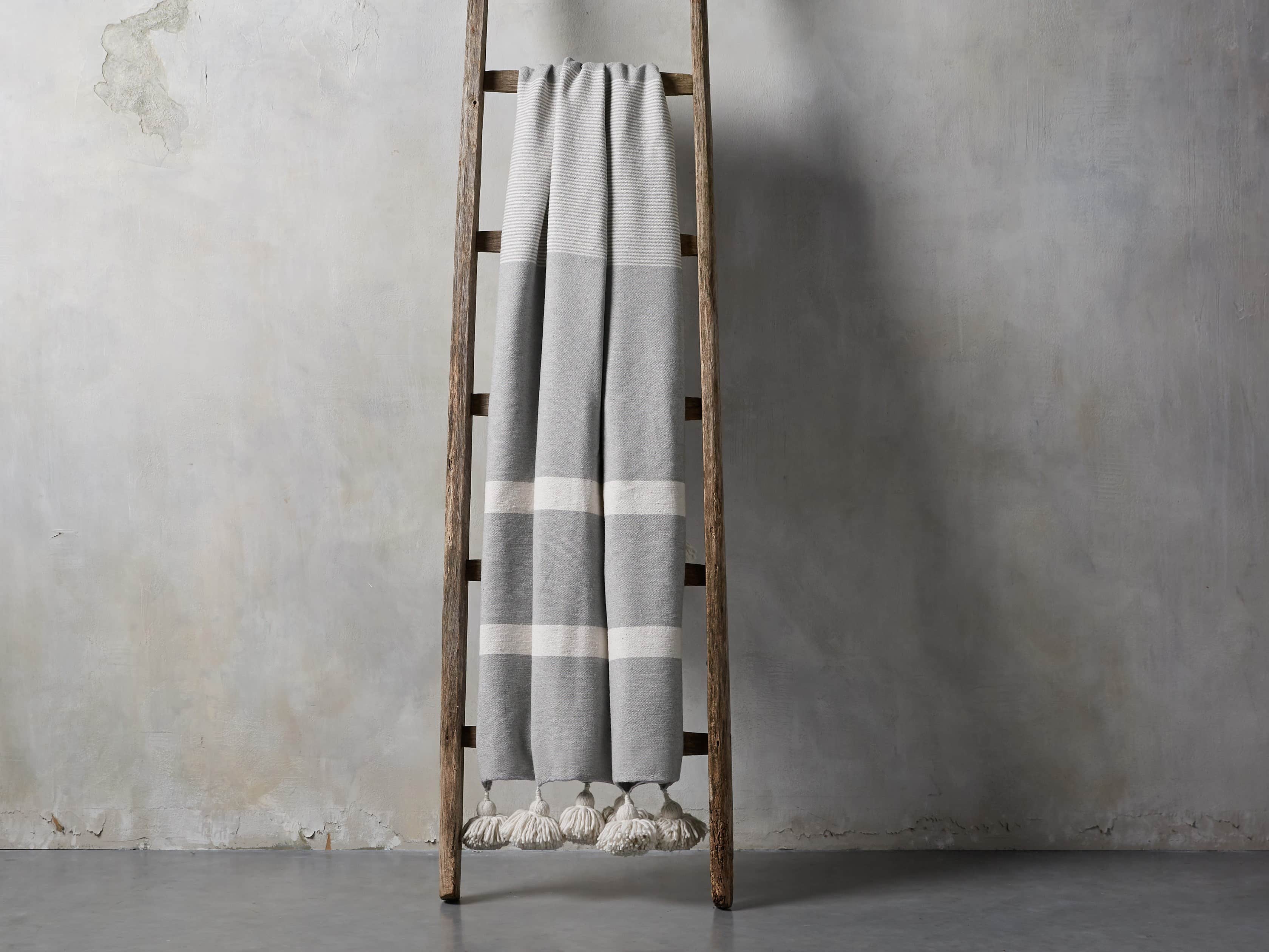 Moroccan Pom Pom Blanket in Grey Stripe