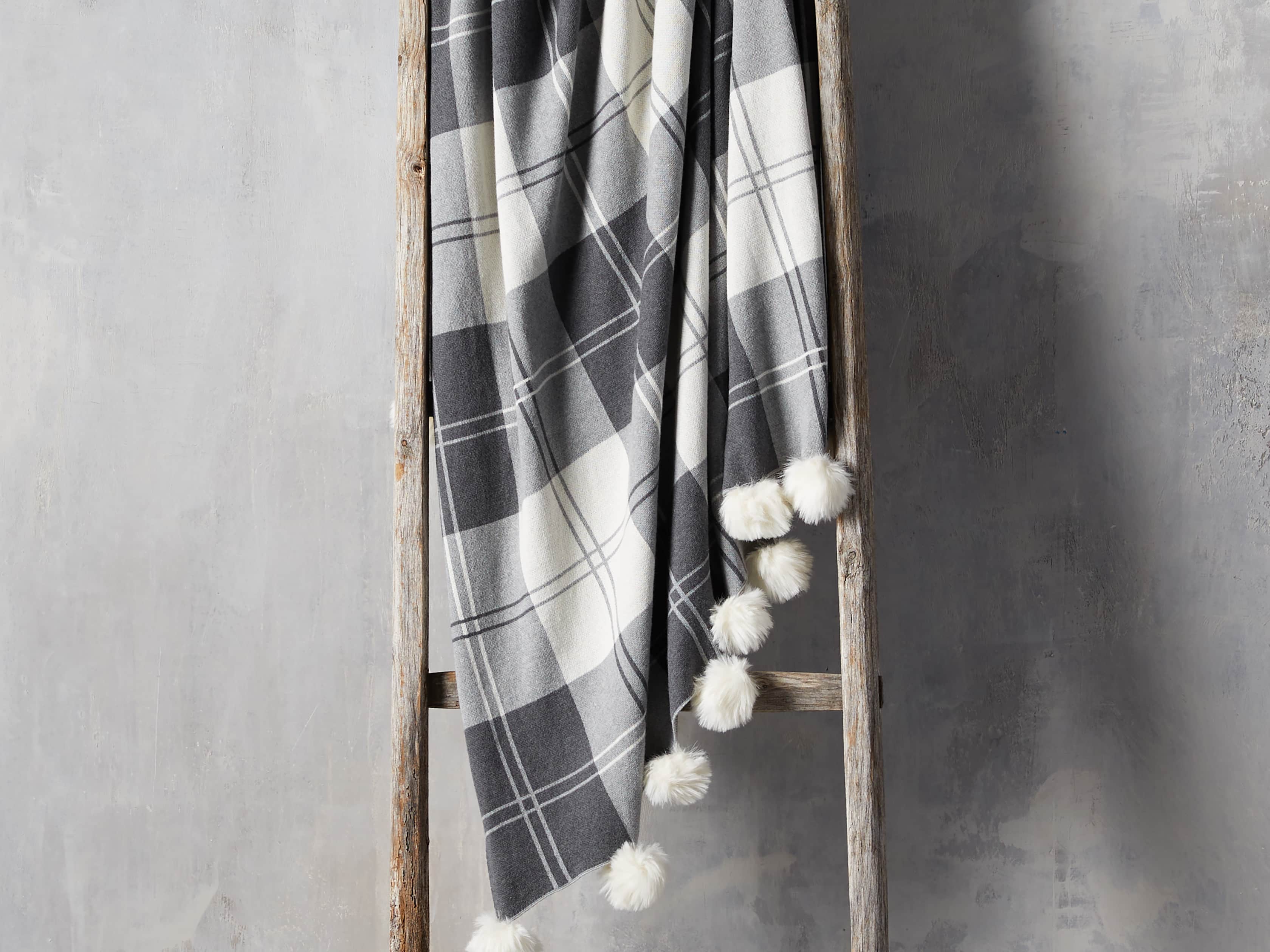Plaid Throw with Faux Fur Pom Poms in Grey, slide 1 of 4