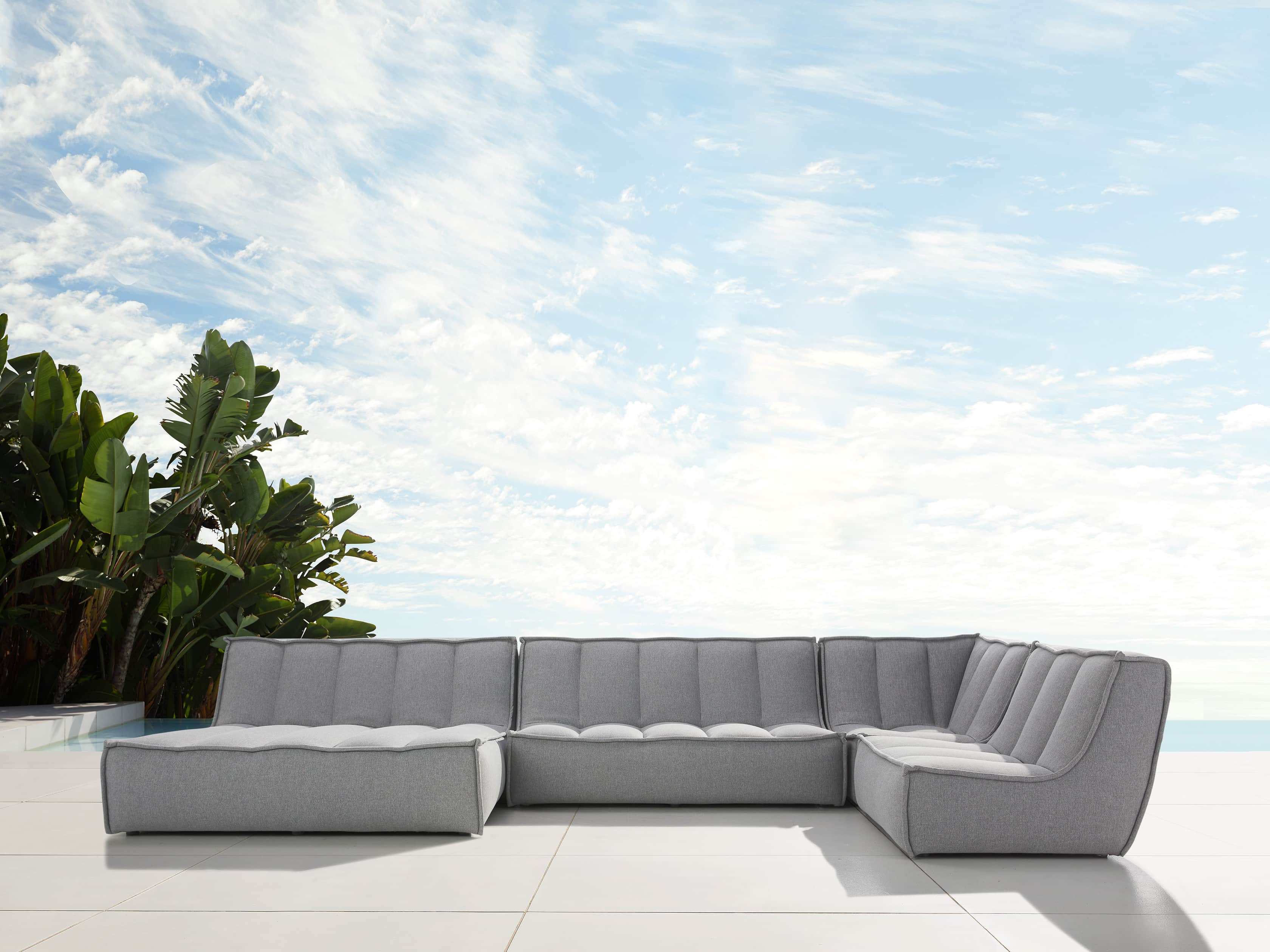Porto Outdoor Upholstered 159" Four Piece Double Chaise Sectional in Southend Grey, slide 1 of 7