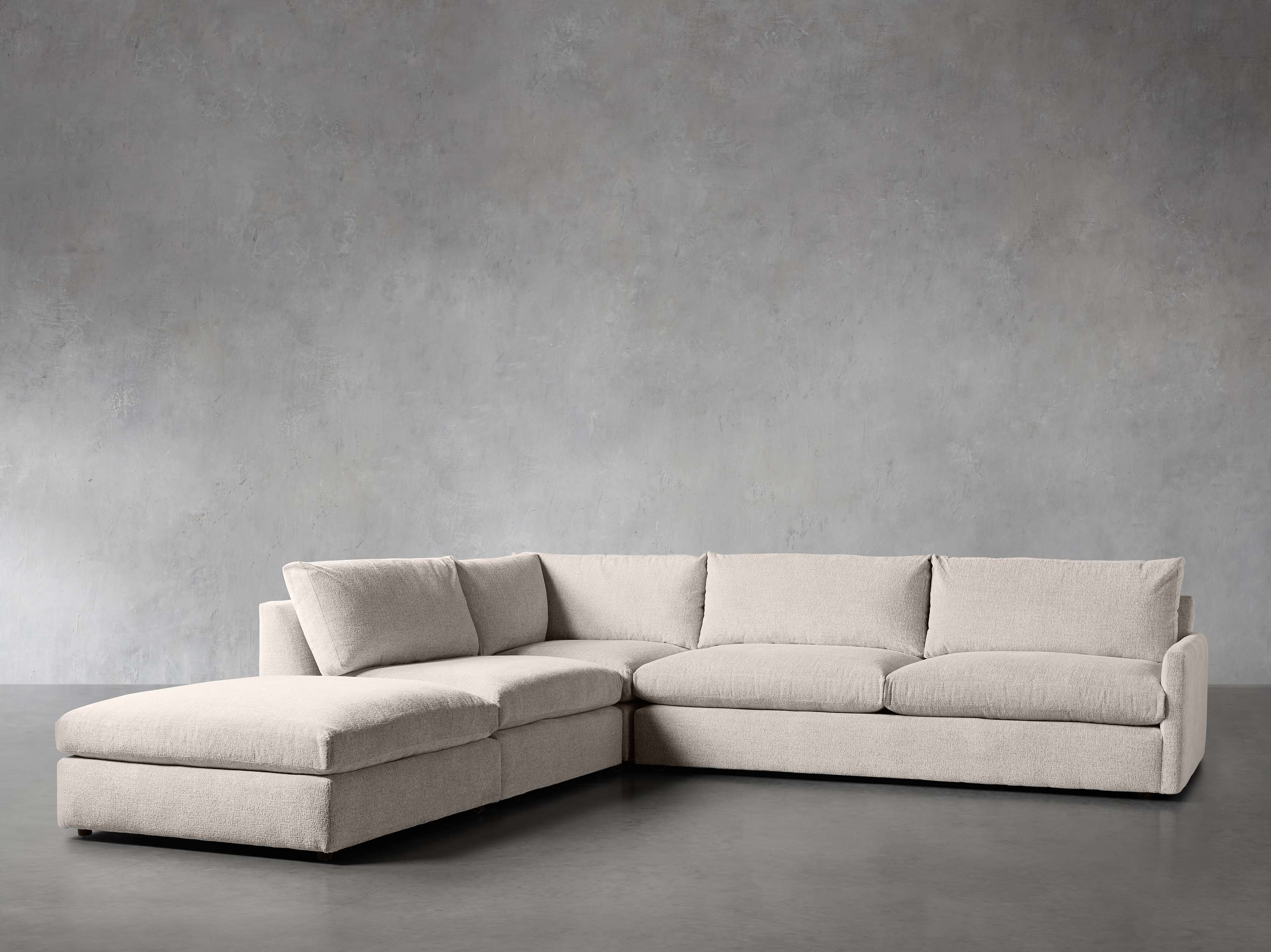 Kipton Upholstered 135" Four Piece Left Arm Sectional