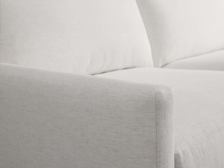 White Kipton Sofa featuring a close-up of the right armrest and seat cushion. The sofa has a smooth, textured fabric with clean, modern lines.