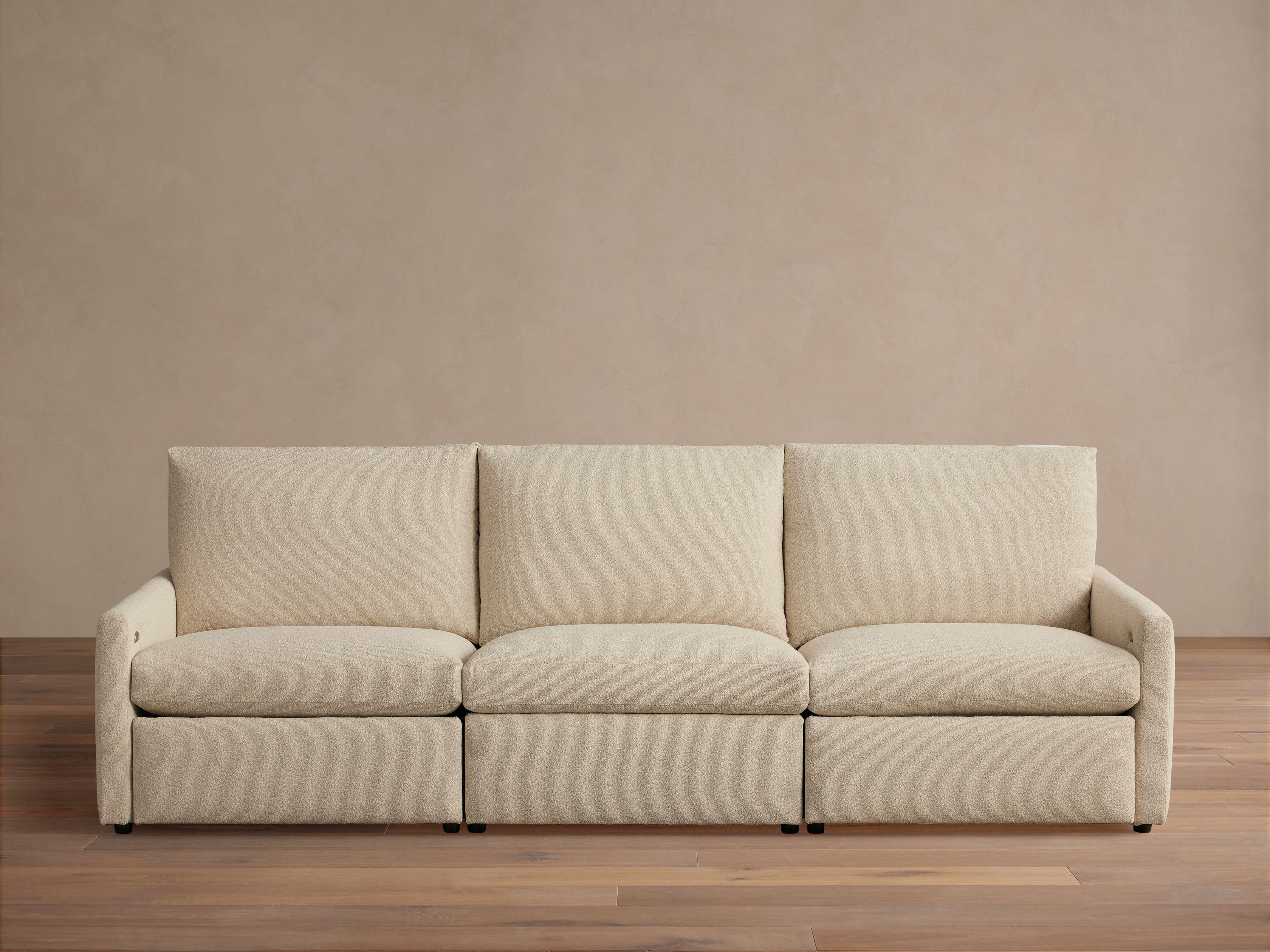 Close-up texture of the beige boucle fabric, showing tight loop detail.