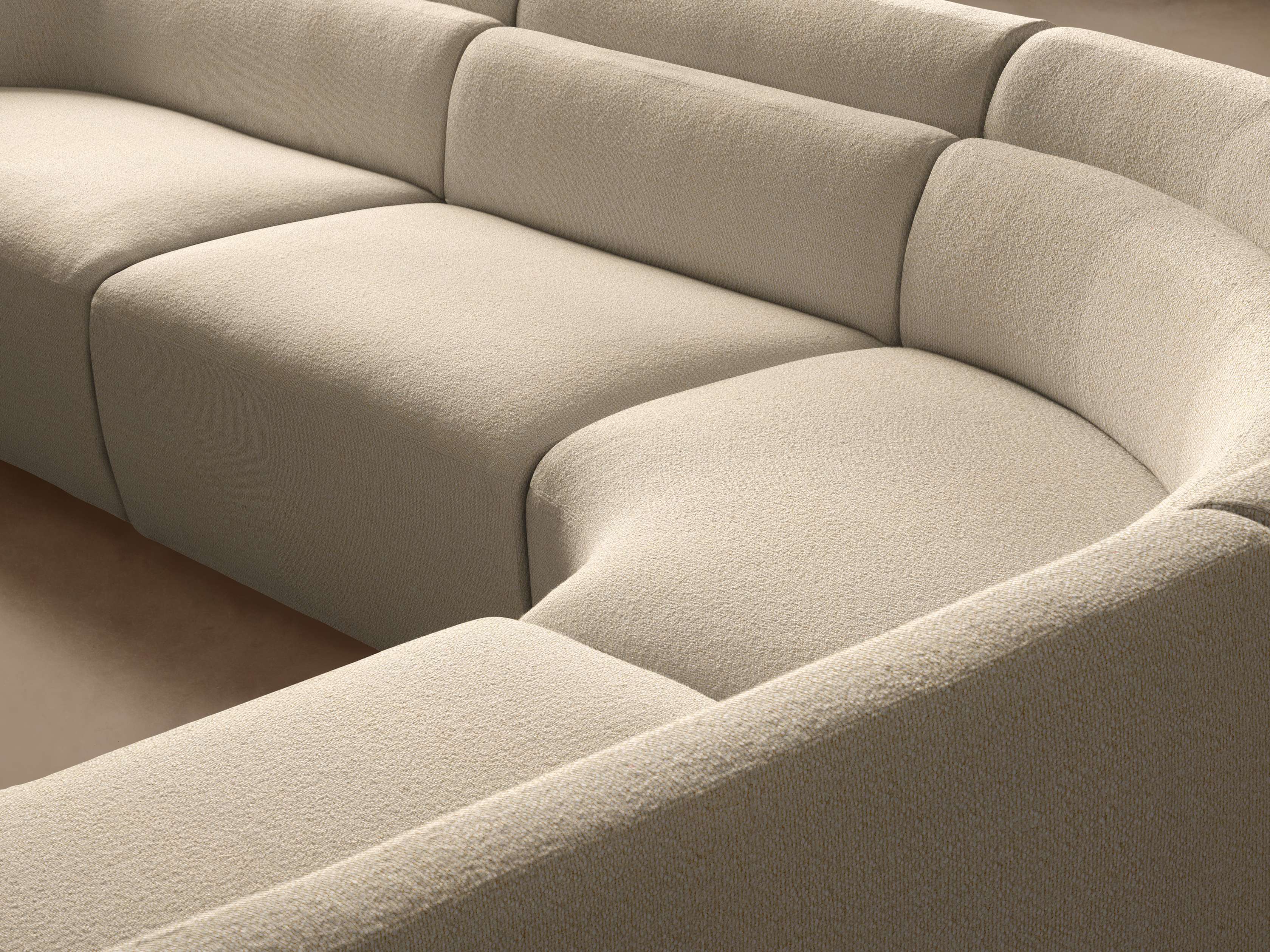 Close-up of cream-colored sofa fabric and stitching