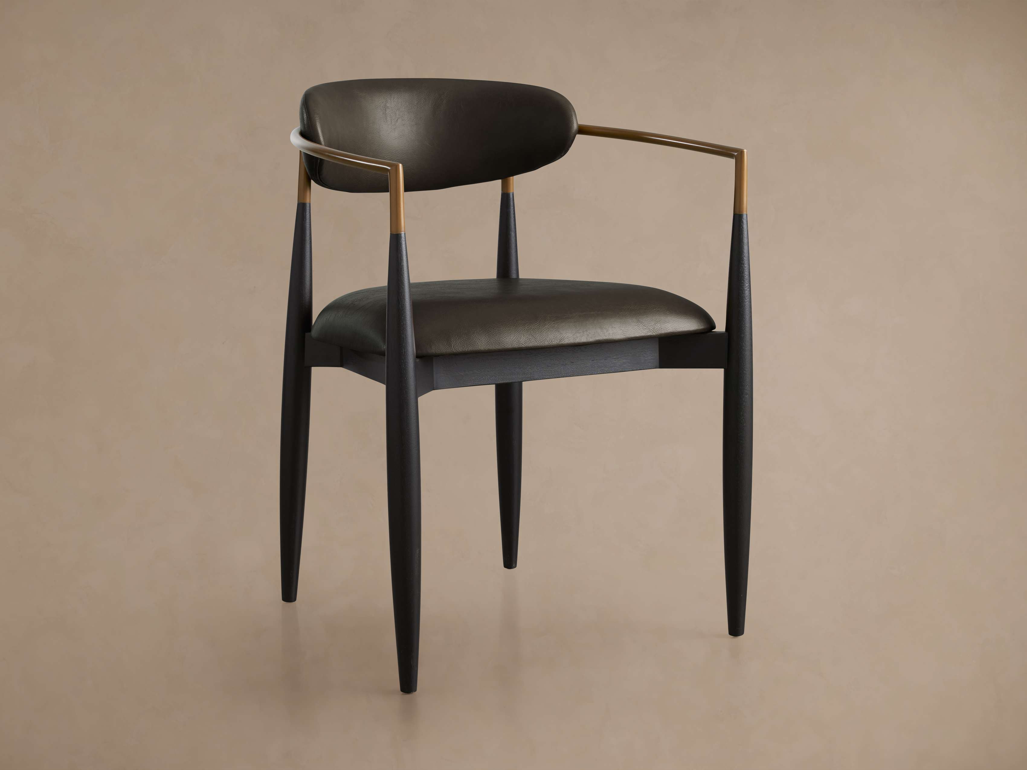 Jagger Faux Leather Dining Arm Chair
– Arhaus