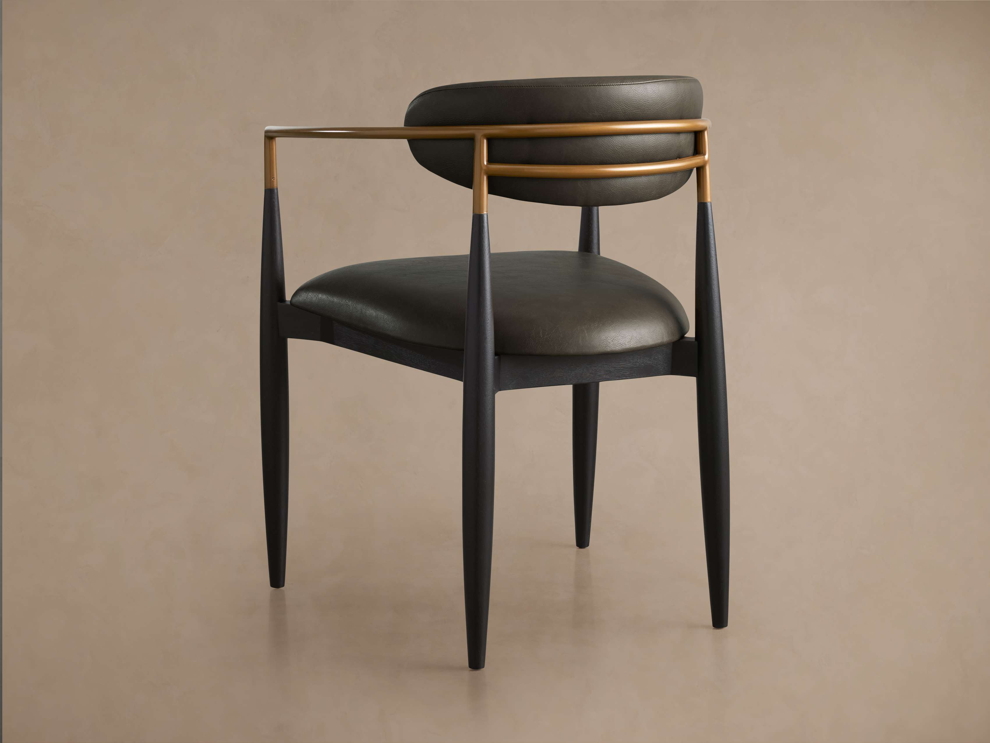 Jagger Faux Leather Dining Arm Chair
– Arhaus