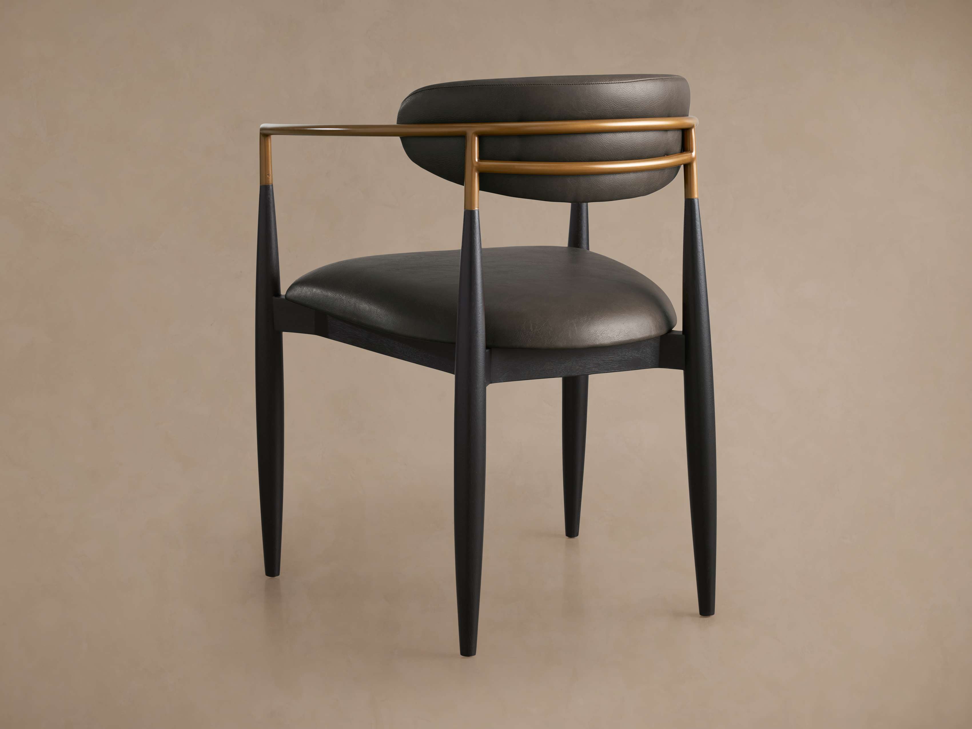 Jagger Faux Leather Dining Arm Chair
– Arhaus