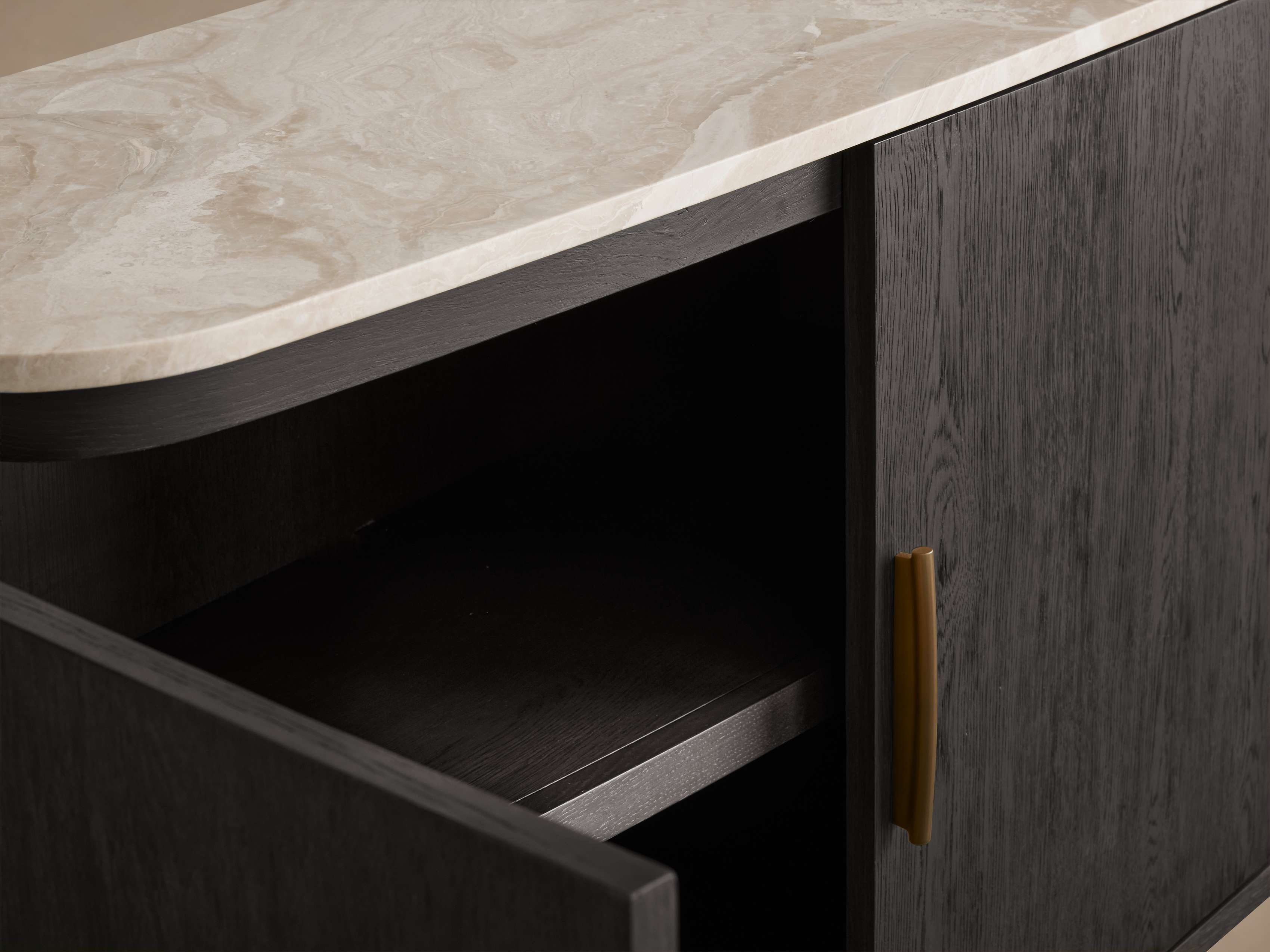 A close-up of the sideboard's marble top and wooden cabinet.