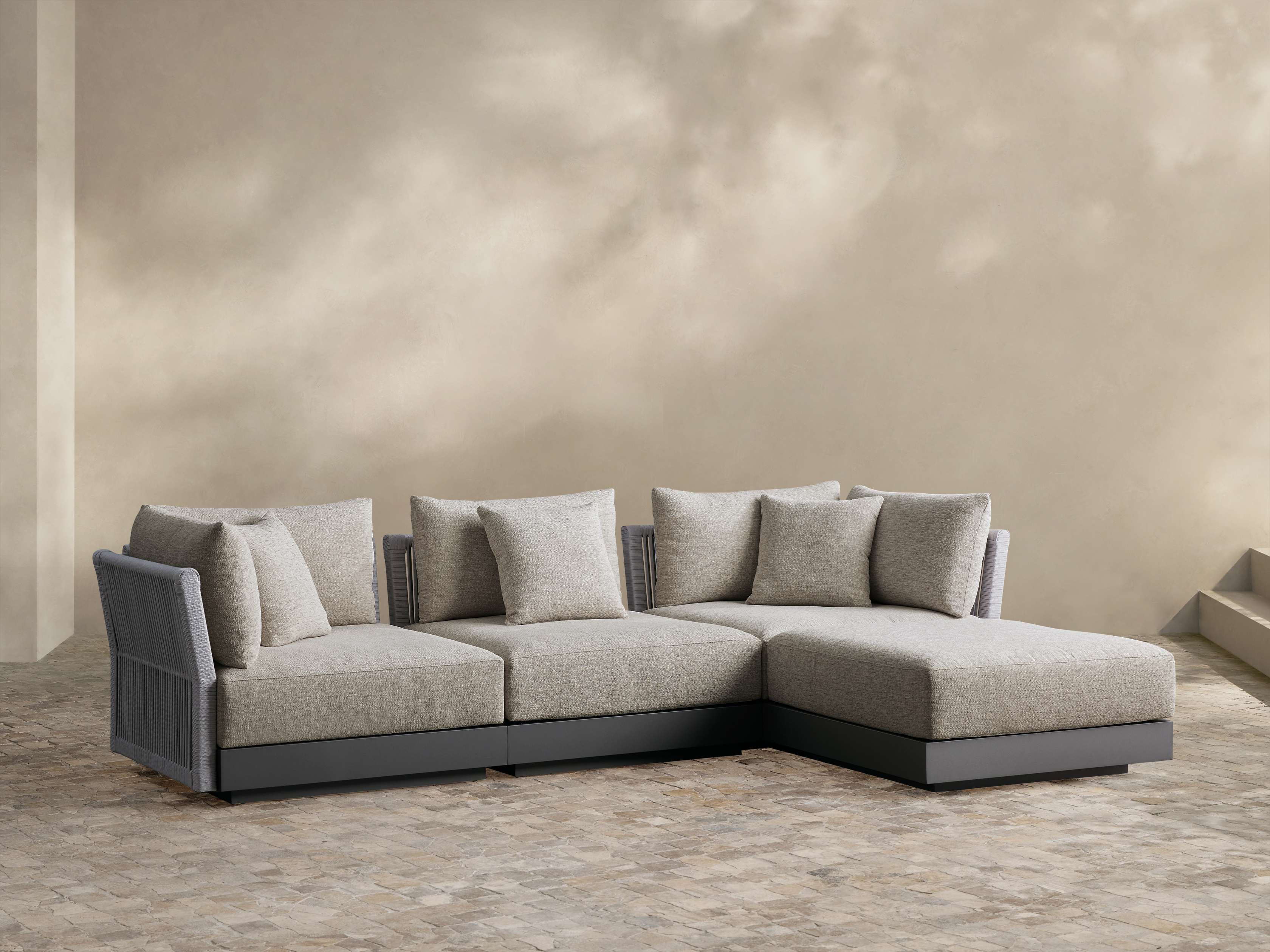 Naxos Outdoor Four-Piece Sectional with Ottoman – Arhaus