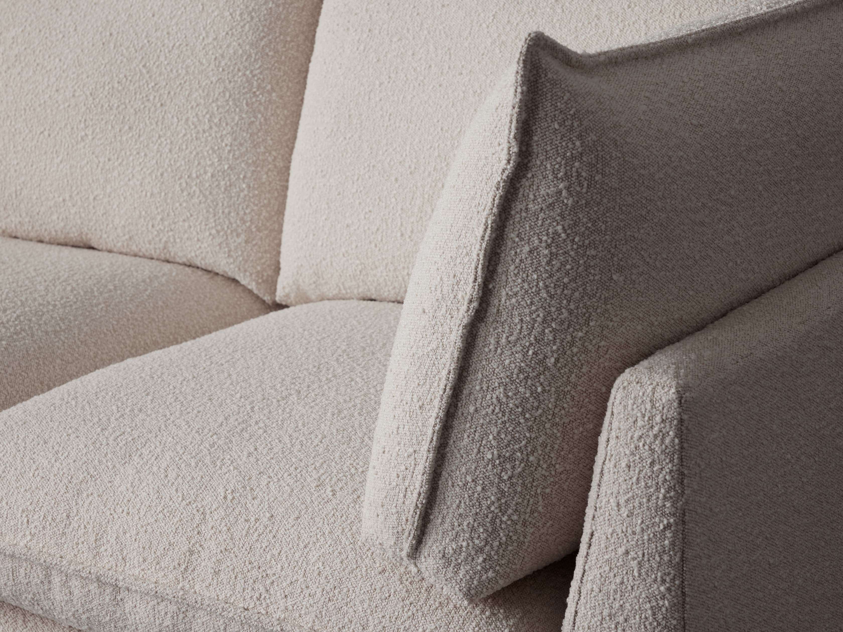 A close-up of the sofa's fabric and stitching.